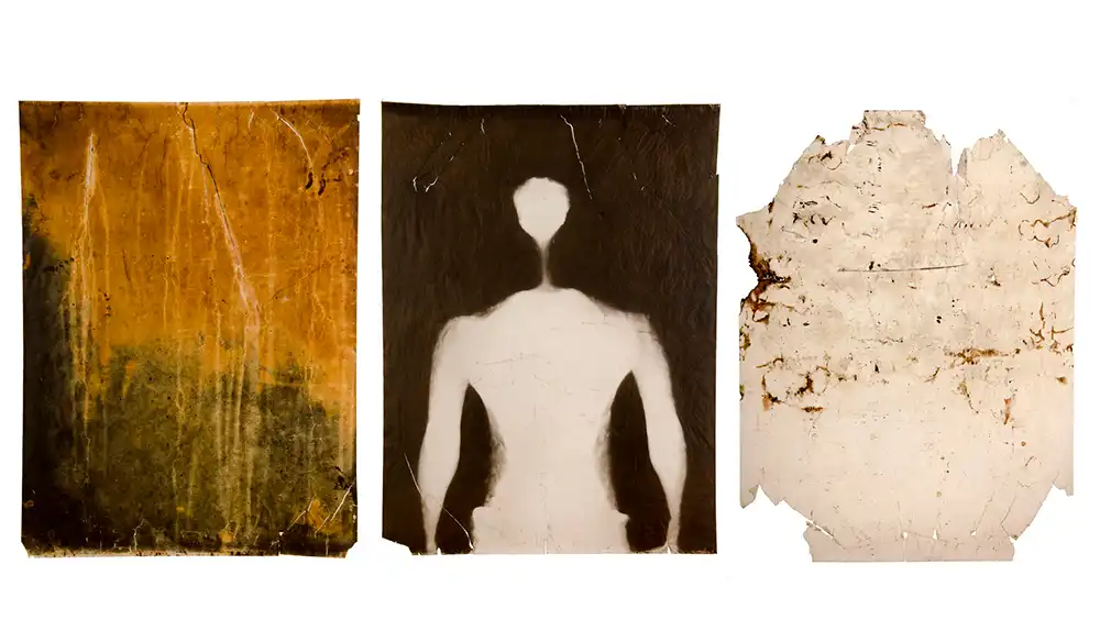Taller fotografía química contemporánea - Revela't 2026 Triptych of aged panels: left rust-yellow texture, center white-back silhouette, right torn beige parchment.