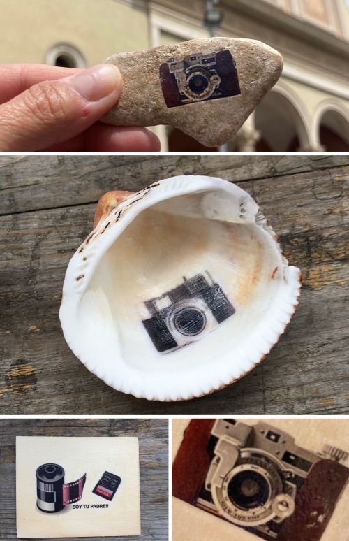 Collage of four images showing small camera stickers placed on a rock, inside a shell, on a card, and a vintage camera illustration under glassy detail.